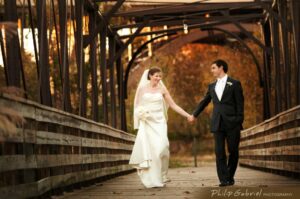 Wedding Couple Walking on Bridge