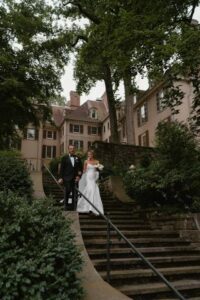 Bride and Groom Walking Down Stairs